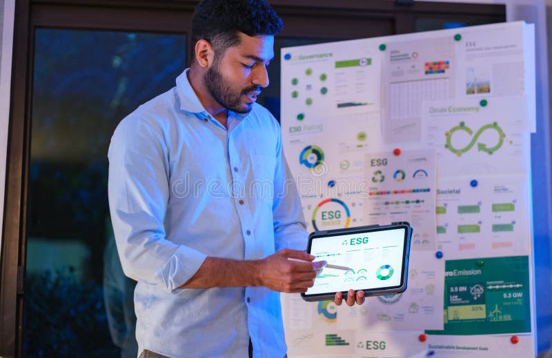 Diversity team presentation about ESG (environment,socail,governance) sustainability business goals sdgs in green office at night stock images