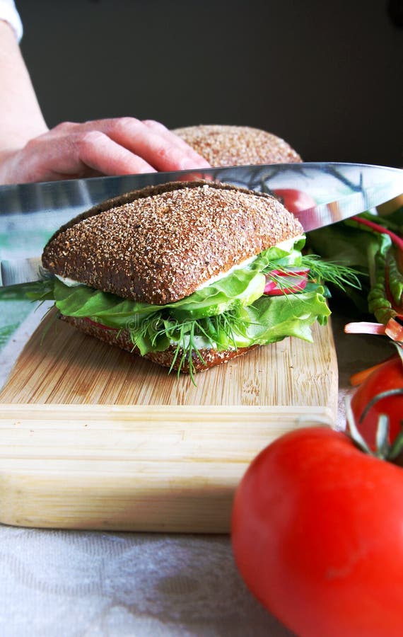 Dividing Healthy Rye Bread Sandwich In Half Picture. Image 9977967