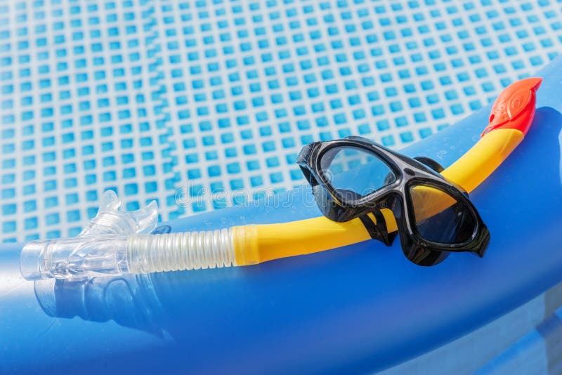 Diving mask and snorkel at the swimming pool