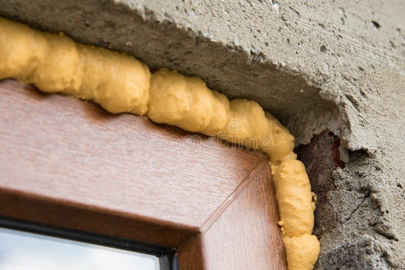 Construction PU foam in the window installed using a mounting installation  foam Stock Photo by ©photovs 311422434