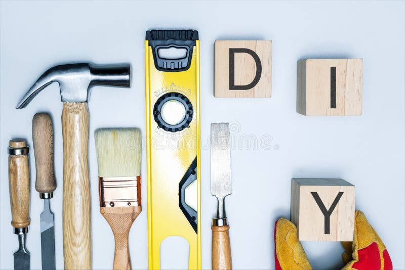 DIY Word Written on Wood Blocks and Construction Tools. Stock Image