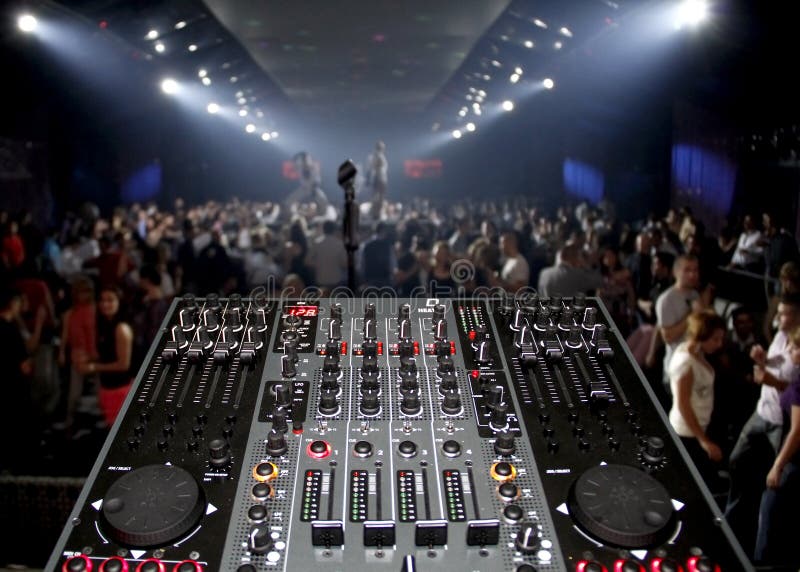 DJ desk in a nightclub party with lightshow royalty free stock images DJ desk in a nightclub party with lightshow royalty free stock images