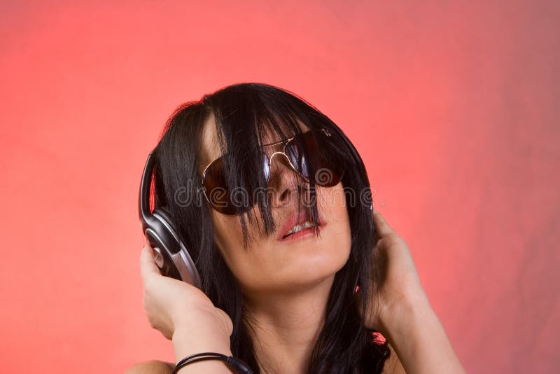 DJ girl listening music in headphones