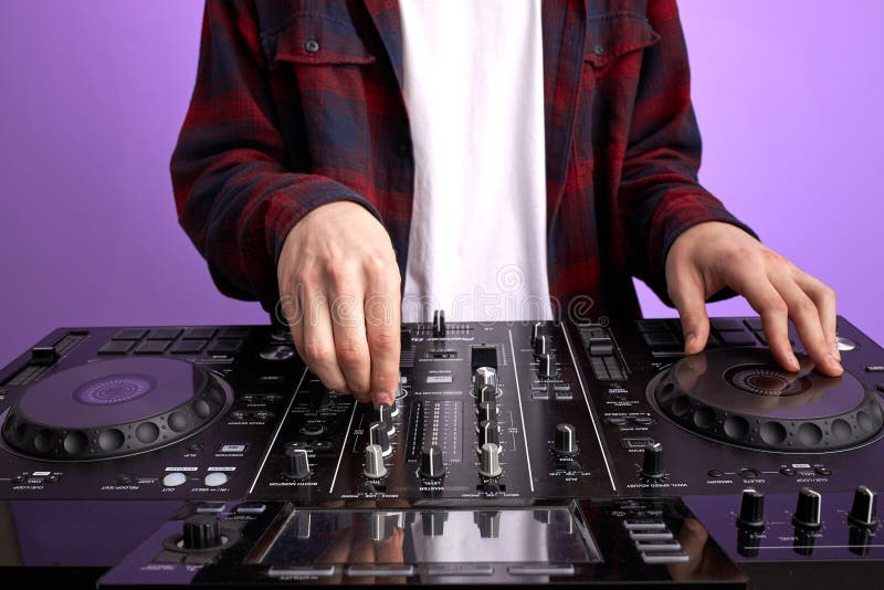 Dj Man in White Headphones Behind Dj Console, Makes Song with Dj Controller.  Stock Photo - Image of jockey, needle: 193693960