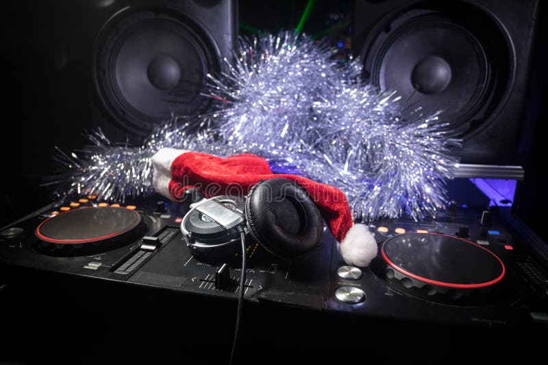 Dj Mixer with Headphones on Dark Nightclub Background with Christmas Tree  New Year Eve. Close Up View of New Year Elements on a Dj Stock Photo -  Image of light, night: 133404078
