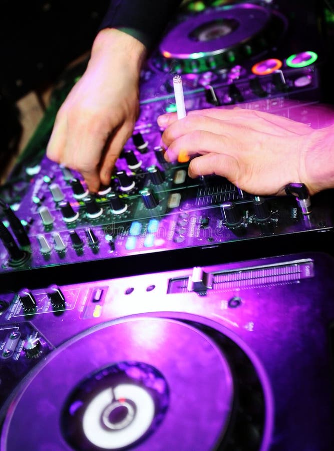 Dj Mixes the Track in at Party with Dancing People on Blur