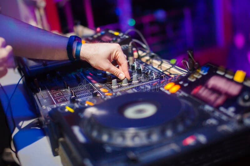 DJ Mixing Music On Console At The Night Club Stock Image Image of