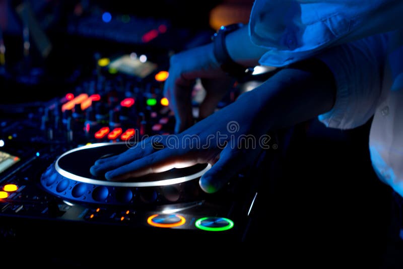 DJ mixing and scratching music at a concert