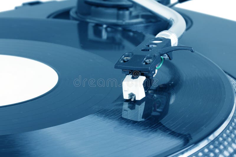 Dj needle on spinning turntable