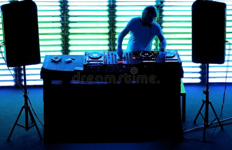 Dj playing the track in the nightclub stock photography