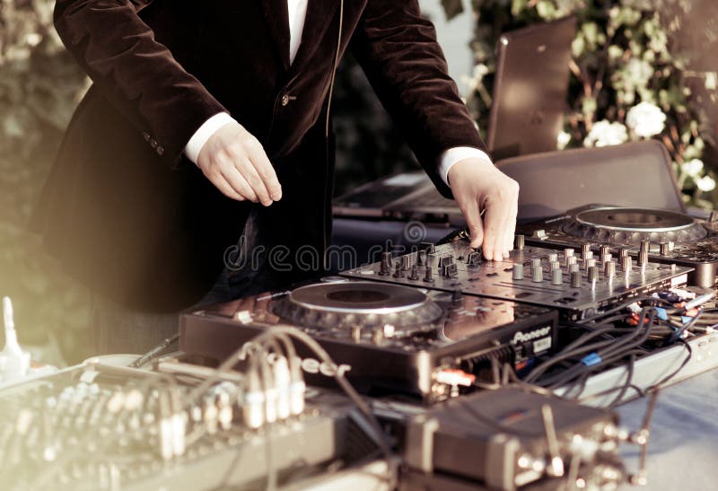 Dj playing the track in the nightclub stock image