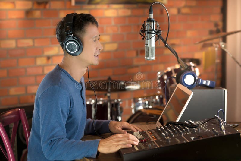 DJ Working at Radio Broadcasting Studio,hands Adjusting Volume. Stock