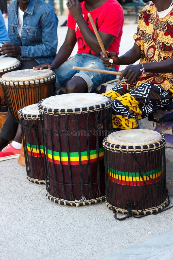 Djembe drummers playing stock image. Image of fingers 69782319