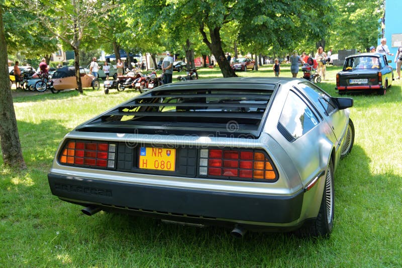 The DMC DeLorean (often referred to as the "DeLorean") is a rear-engine, two-door, two-passenger sports car manufactured and marketed by John DeLorean's DeLorean Motor Company (DMC) for the American market from 1981 to 1983â€”ultimately the only car brought to market by the fledgling company. Designed by Giorgetto Giugiaro and noted for its gull-wing doors and brushed stainless-steel outer body panels, the sports car was also noted for a lack of power and performance incongruous with its looks and price. Though its production was short-lived, the car became widely known when featured as the time machine in the Back to the Future media franchise. The DMC DeLorean (often referred to as the "DeLorean") is a rear-engine, two-door, two-passenger sports car manufactured and marketed by John DeLorean's DeLorean Motor Company (DMC) for the American market from 1981 to 1983â€”ultimately the only car brought to market by the fledgling company. Designed by Giorgetto Giugiaro and noted for its gull-wing doors and brushed stainless-steel outer body panels, the sports car was also noted for a lack of power and performance incongruous with its looks and price. Though its production was short-lived, the car became widely known when featured as the time machine in the Back to the Future media franchise.