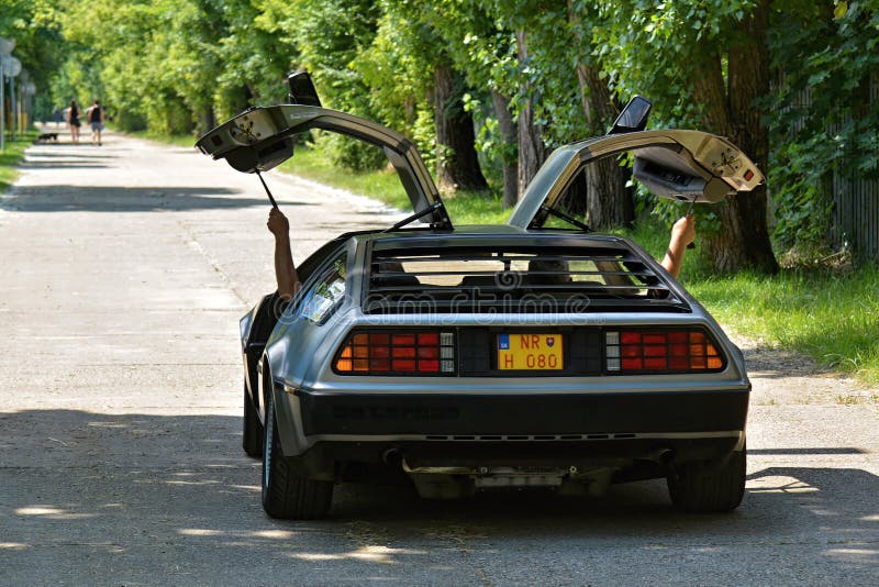 The DMC DeLorean (often referred to as the "DeLorean") is a rear-engine, two-door, two-passenger sports car manufactured and marketed by John DeLorean's DeLorean Motor Company (DMC) for the American market from 1981 to 1983â€”ultimately the only car brought to market by the fledgling company. Designed by Giorgetto Giugiaro and noted for its gull-wing doors and brushed stainless-steel outer body panels, the sports car was also noted for a lack of power and performance incongruous with its looks and price. Though its production was short-lived, the car became widely known when featured as the time machine in the Back to the Future media franchise. The DMC DeLorean (often referred to as the "DeLorean") is a rear-engine, two-door, two-passenger sports car manufactured and marketed by John DeLorean's DeLorean Motor Company (DMC) for the American market from 1981 to 1983â€”ultimately the only car brought to market by the fledgling company. Designed by Giorgetto Giugiaro and noted for its gull-wing doors and brushed stainless-steel outer body panels, the sports car was also noted for a lack of power and performance incongruous with its looks and price. Though its production was short-lived, the car became widely known when featured as the time machine in the Back to the Future media franchise.