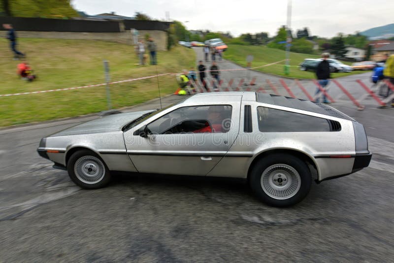 The DMC DeLorean (often referred to as the DeLorean) is a rear-engine, two-door, two-passenger sports car manufactured and marketed by John DeLorean's DeLorean Motor Company (DMC) for the American market from 1981 to 1983â€”ultimately the only car brought to market by the fledgling company. Designed by Giorgetto Giugiaro and noted for its gull-wing doors and brushed stainless-steel outer body panels, the sports car was also noted for a lack of power and performance incongruous with its looks and price. Though its production was short-lived, the car became widely known when featured as the time machine in the Back to the Future media franchise. The DMC DeLorean (often referred to as the DeLorean) is a rear-engine, two-door, two-passenger sports car manufactured and marketed by John DeLorean's DeLorean Motor Company (DMC) for the American market from 1981 to 1983â€”ultimately the only car brought to market by the fledgling company. Designed by Giorgetto Giugiaro and noted for its gull-wing doors and brushed stainless-steel outer body panels, the sports car was also noted for a lack of power and performance incongruous with its looks and price. Though its production was short-lived, the car became widely known when featured as the time machine in the Back to the Future media franchise.