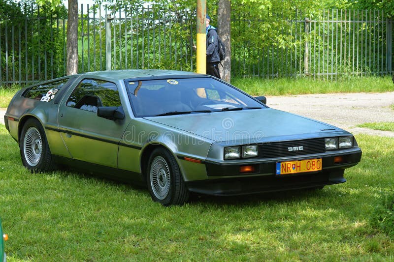 The DMC DeLorean (often referred to as the "DeLorean") is a rear-engine, two-door, two-passenger sports car manufactured and marketed by John DeLorean's DeLorean Motor Company (DMC) for the American market from 1981 to 1983â€”ultimately the only car brought to market by the fledgling company. Designed by Giorgetto Giugiaro and noted for its gull-wing doors and brushed stainless-steel outer body panels, the sports car was also noted for a lack of power and performance incongruous with its looks and price. Though its production was short-lived, the car became widely known when featured as the time machine in the Back to the Future media franchise. The DMC DeLorean (often referred to as the "DeLorean") is a rear-engine, two-door, two-passenger sports car manufactured and marketed by John DeLorean's DeLorean Motor Company (DMC) for the American market from 1981 to 1983â€”ultimately the only car brought to market by the fledgling company. Designed by Giorgetto Giugiaro and noted for its gull-wing doors and brushed stainless-steel outer body panels, the sports car was also noted for a lack of power and performance incongruous with its looks and price. Though its production was short-lived, the car became widely known when featured as the time machine in the Back to the Future media franchise.