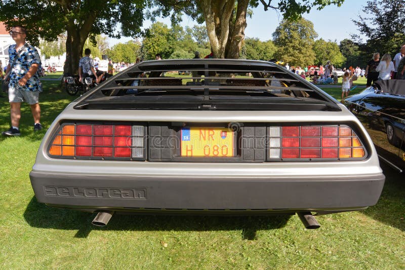 The DMC DeLorean (often referred to as the "DeLorean") is a rear-engine, two-door, two-passenger sports car manufactured and marketed by John DeLorean's DeLorean Motor Company (DMC) for the American market from 1981 to 1983â€”ultimately the only car brought to market by the fledgling company. Designed by Giorgetto Giugiaro and noted for its gull-wing doors and brushed stainless-steel outer body panels, the sports car was also noted for a lack of power and performance incongruous with its looks and price. Though its production was short-lived, the car became widely known when featured as the time machine in the Back to the Future media franchise. The DMC DeLorean (often referred to as the "DeLorean") is a rear-engine, two-door, two-passenger sports car manufactured and marketed by John DeLorean's DeLorean Motor Company (DMC) for the American market from 1981 to 1983â€”ultimately the only car brought to market by the fledgling company. Designed by Giorgetto Giugiaro and noted for its gull-wing doors and brushed stainless-steel outer body panels, the sports car was also noted for a lack of power and performance incongruous with its looks and price. Though its production was short-lived, the car became widely known when featured as the time machine in the Back to the Future media franchise.