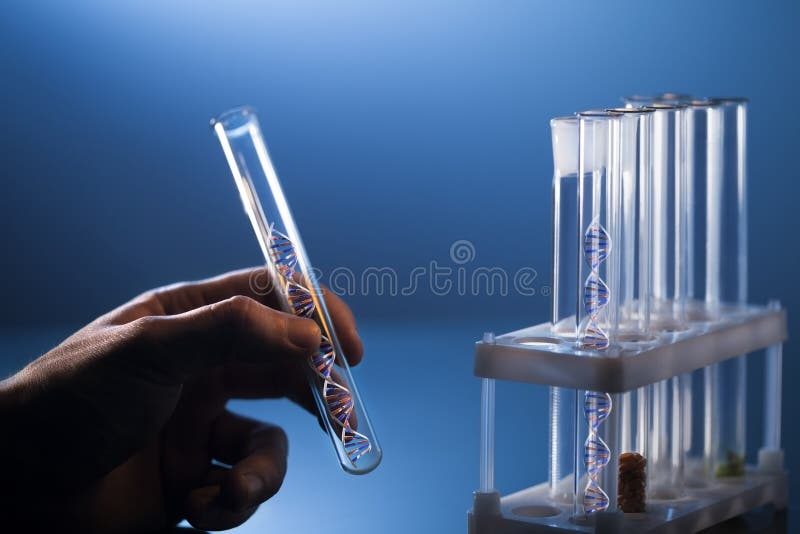 DNA molecule in glass tube in hand of scientist on blue