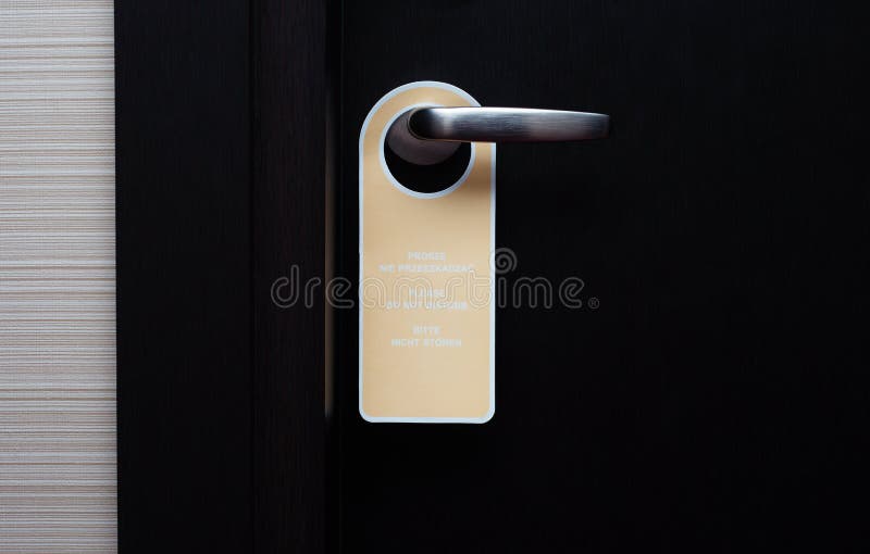 Do not disturb sign handle on a hotel door, close up