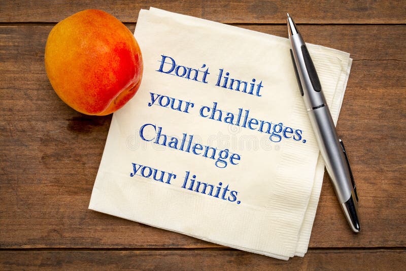 Do not limit your challenges. Challenge your limits. Inspirational handwriting on napkin with a fresh apricot.