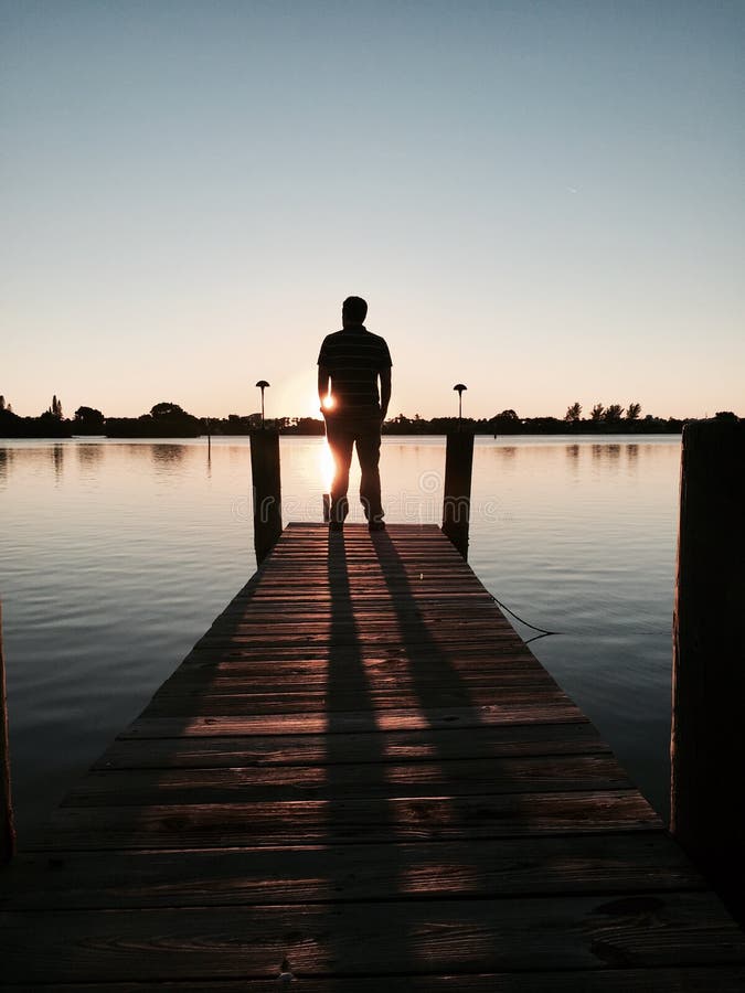 Dock of the Bay stock photo. Image of sunset, dock, silhouetted - 49679860