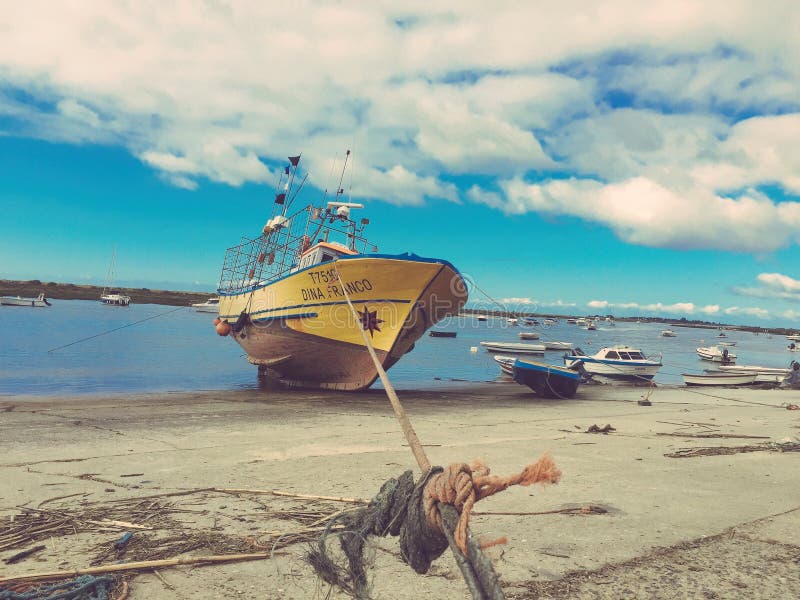 A Portuguese Fishing Boat Sits moored in dry dock in the village of Cabanas. A Portuguese Fishing Boat Sits moored in dry dock in the village of Cabanas