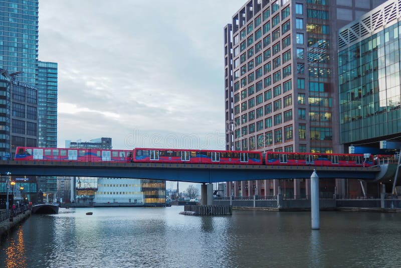 View of Docklands Light Railway DLR train at Canary Wharf business district, London, England, UK. View of Docklands Light Railway DLR train at Canary Wharf business district, London, England, UK.