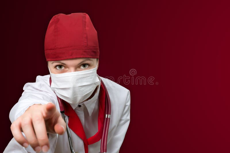 Docteur de femme avec le fond rouge photo stock Docteur de femme avec le fond rouge photo stock