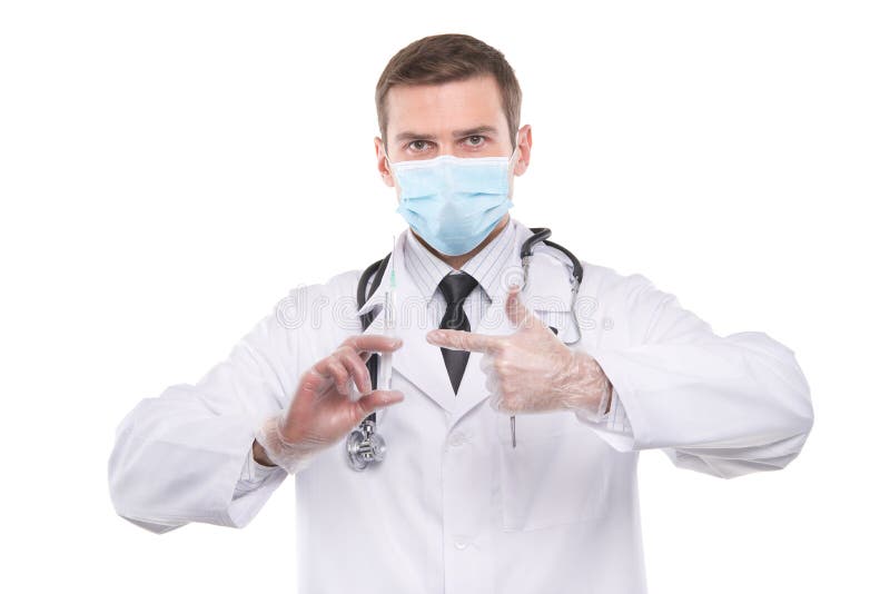 Docteur masculin dans le masque tenant la seringue avec l'injection images stock Docteur masculin dans le masque tenant la seringue avec l'injection images stock