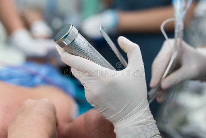Doctor Apply Laryngoscope for Endotracheal Intubation Stock Photo