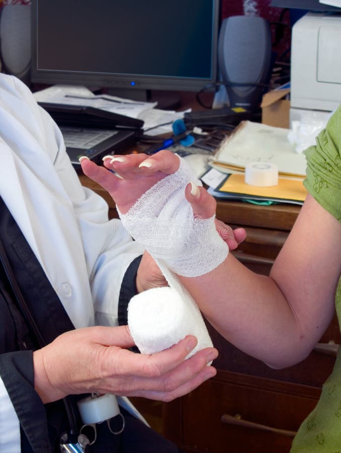 A Doctor In A Dressing Gown Puts On His Hands Blue Sterile Gloves Made