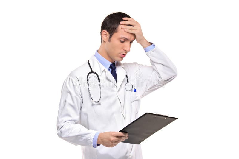 Doctor banging his head realizing a mistake stock image