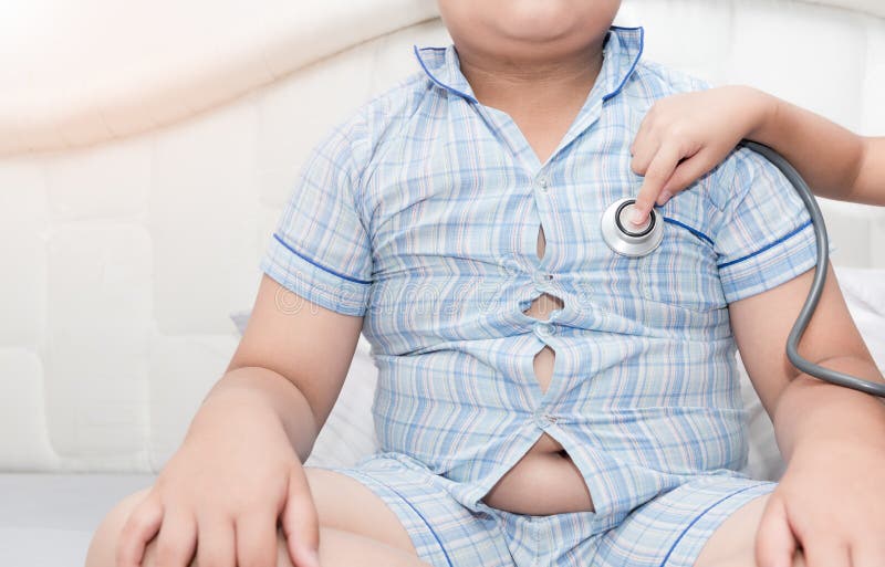 Doctor check heart by stethoscope to obese asian boy