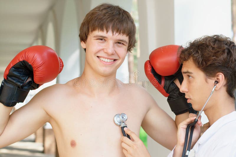 Doctor checking a smiling boxer