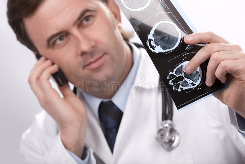 Doctor is checking x- ray