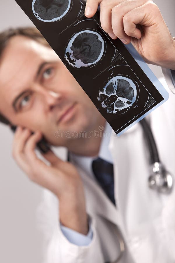 Doctor is checking x- ray