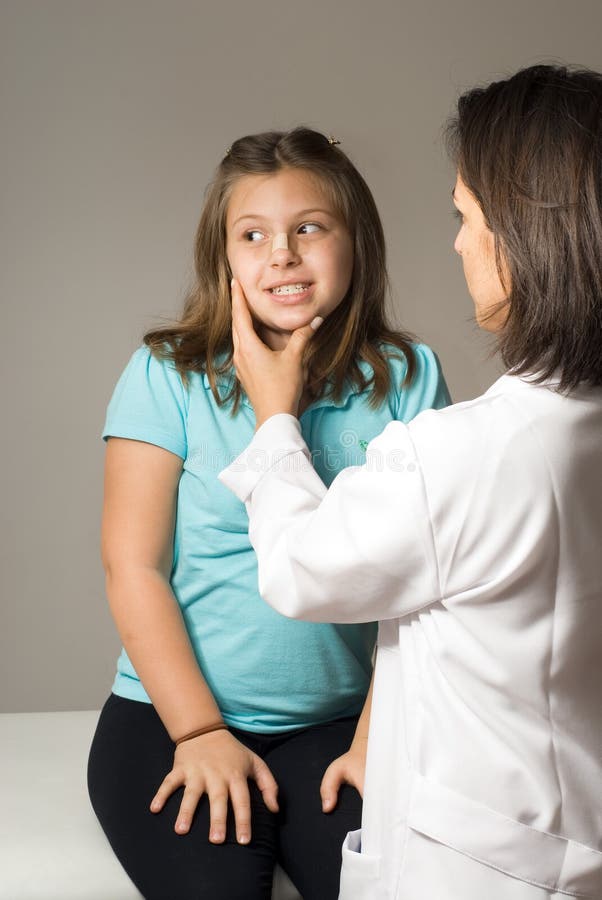 Doctor Checks Girl s Face. Vertical