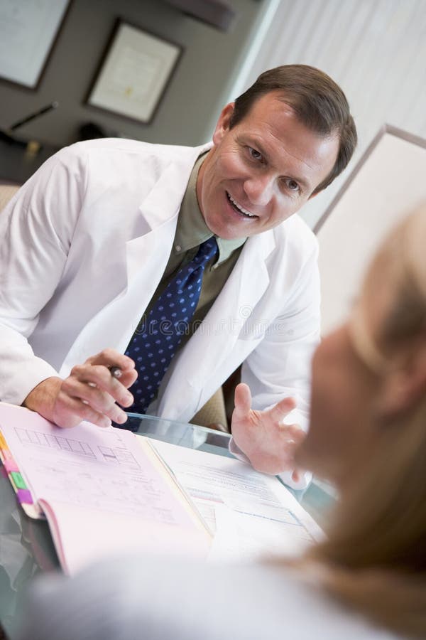 Doctor in consultation with female patient stock images Doctor in consultation with female patient stock images