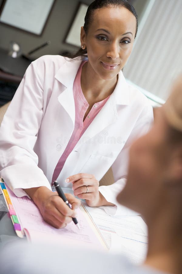 Doctor in consultation with patient in IVF clinic stock image Doctor in consultation with patient in IVF clinic stock image