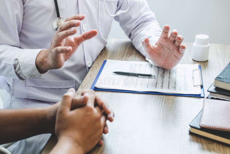 Doctor Consulting with Patient Examining for Patient, Presenting