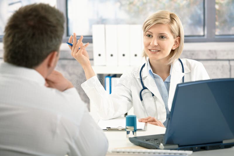 Doctor discussing diagnosis with patient stock photography