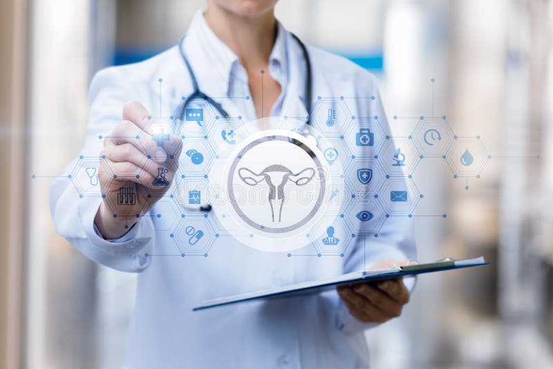 The doctor draws a treatment regimen of the female uterus royalty free stock photos The doctor draws a treatment regimen of the female uterus royalty free stock photos