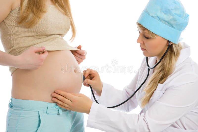 Doctor examines pregnant female using stethoscope