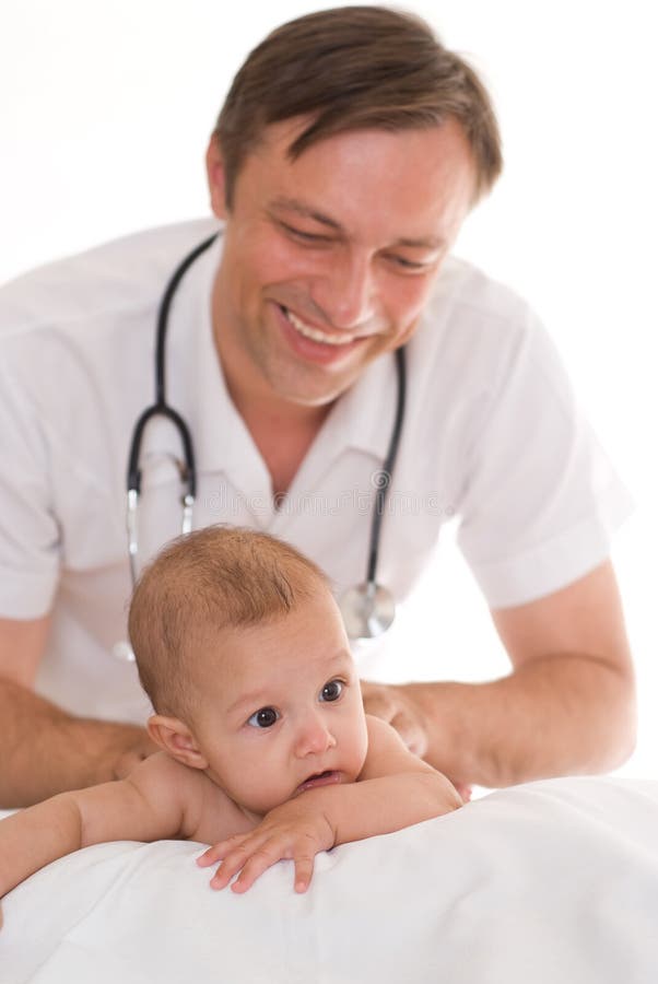 Doctor examining newborn