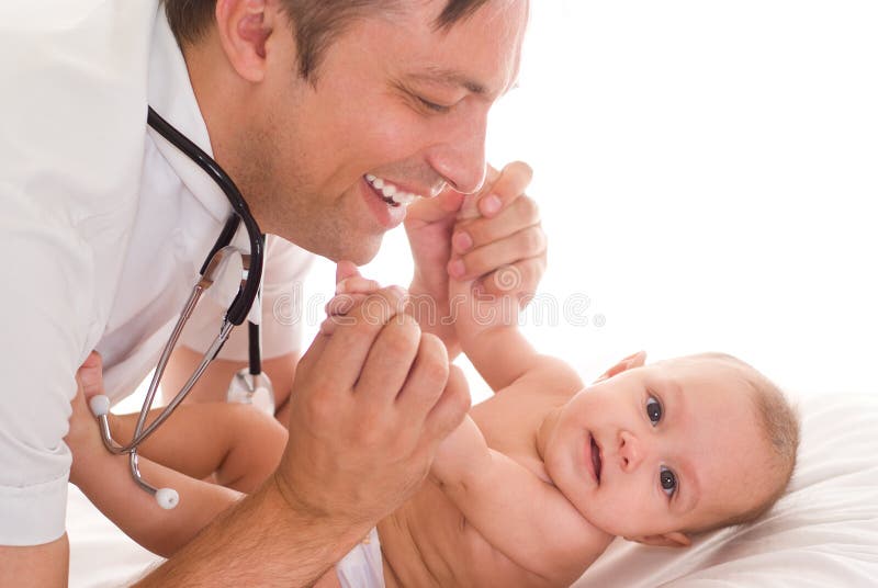 Doctor examining newborn