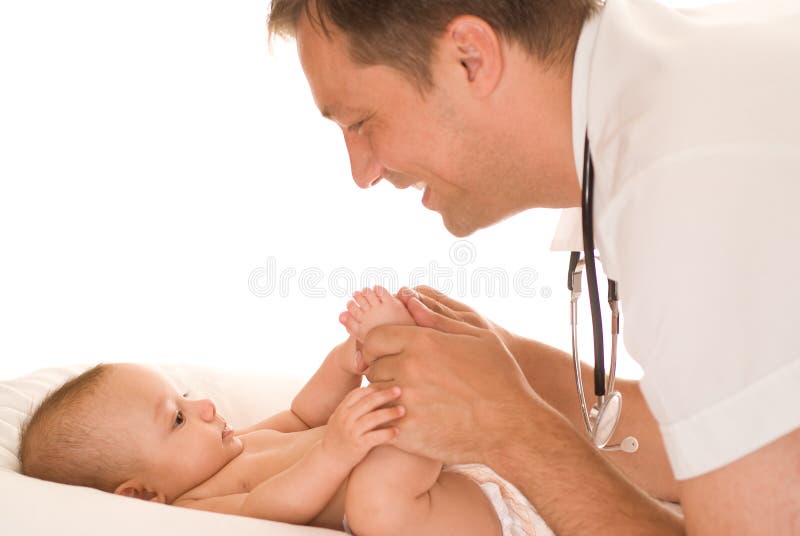 Doctor examining newborn