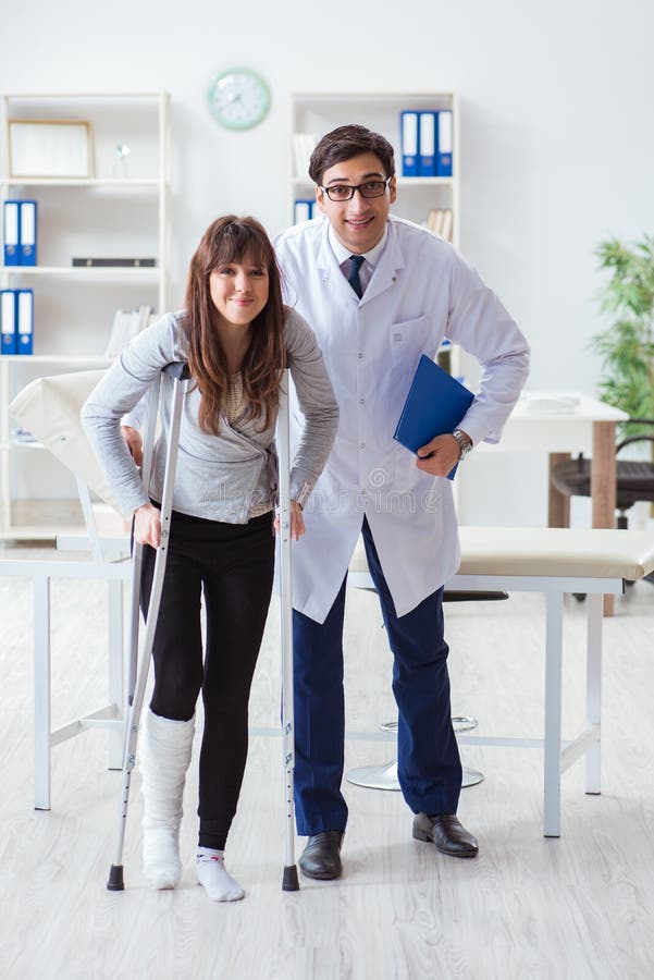 The Doctor Examining Patient with Broken Leg Stock Photo Image of