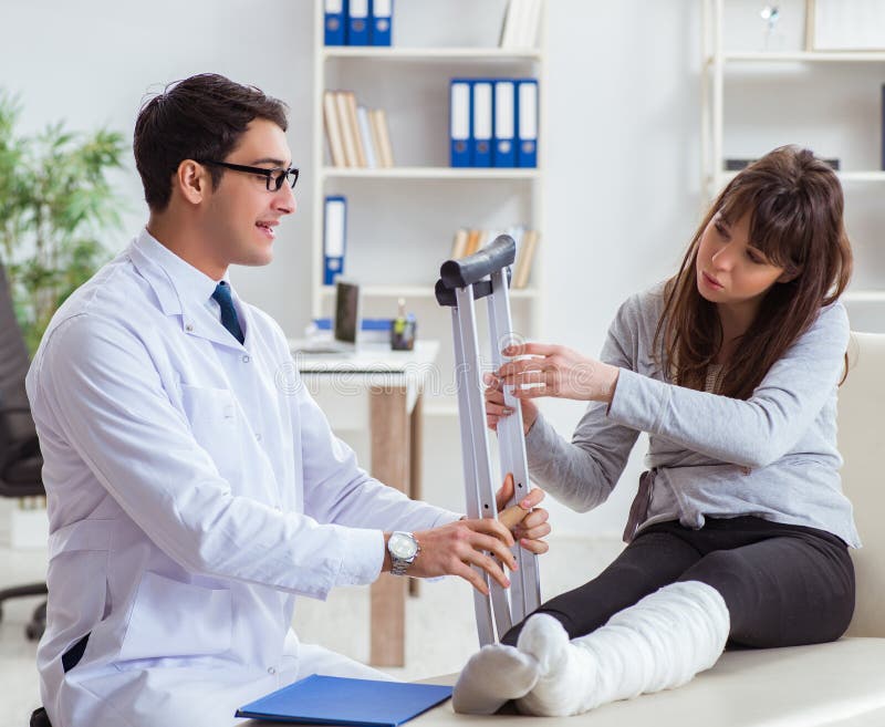 Doctor Examining Patient with Broken Leg Stock Photo Image of