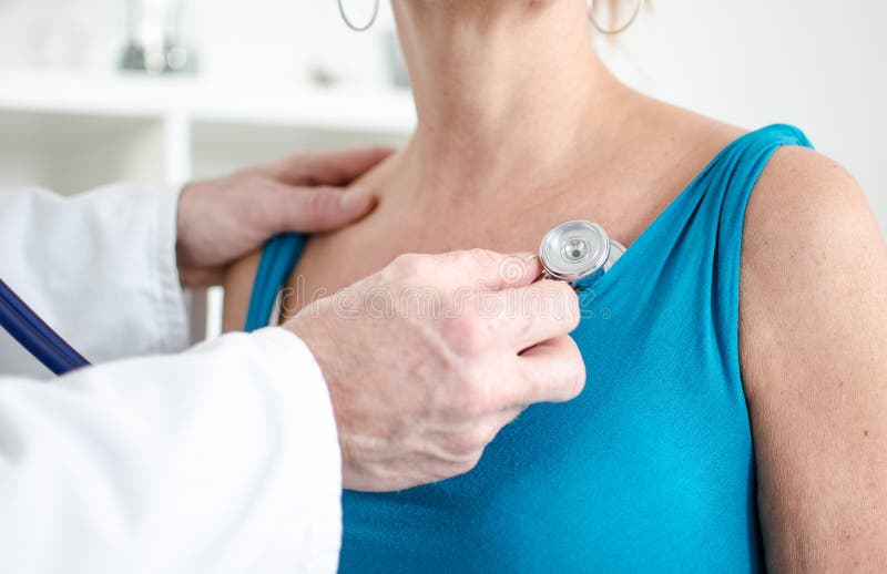 Doctor examining a patient with a stethoscope royalty free stock images Doctor examining a patient with a stethoscope royalty free stock images
